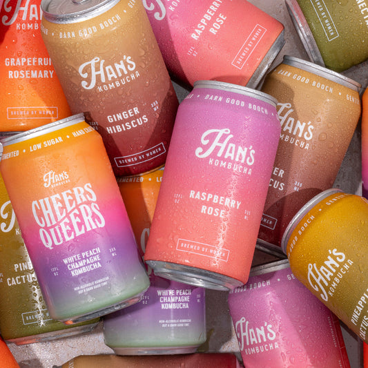 Collection of colorful cans with 'Han's' branding on a textured surface